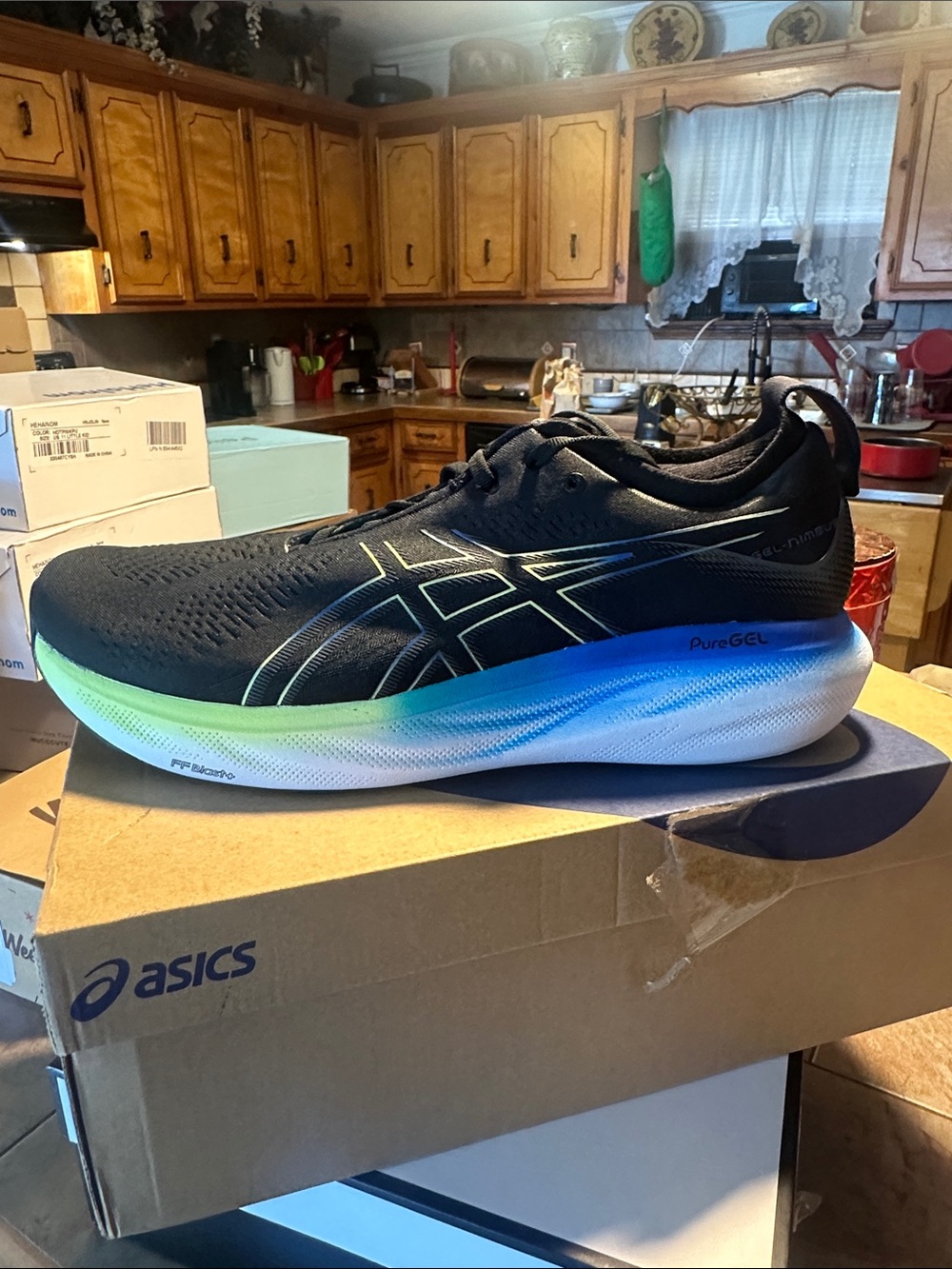 Asics Men's Black Running Shoe with Blue and Green Gradient Midsole